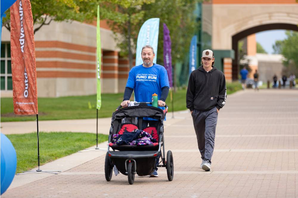 Participants with stroller nearing finish line